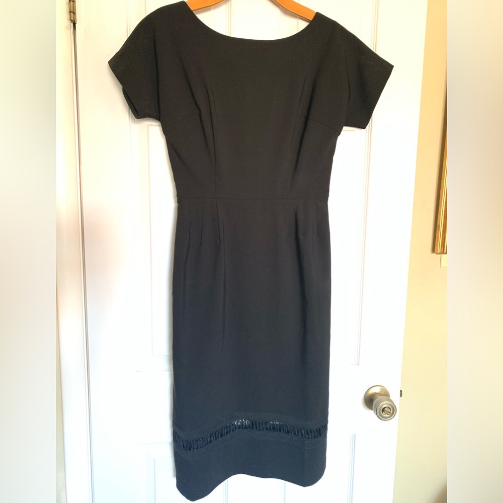 Bettie Page Dress Black Short Sleeve. Fitted Waist.Peek-a-Boo Detail around hem.